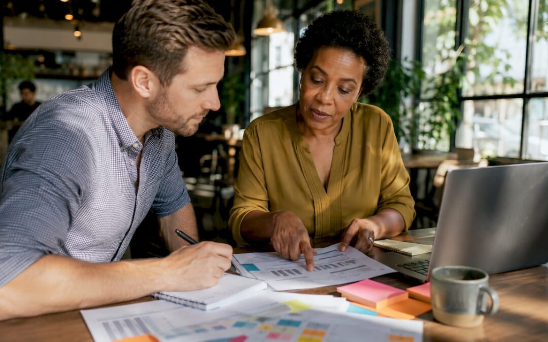 Event planners reviewing budget documents together