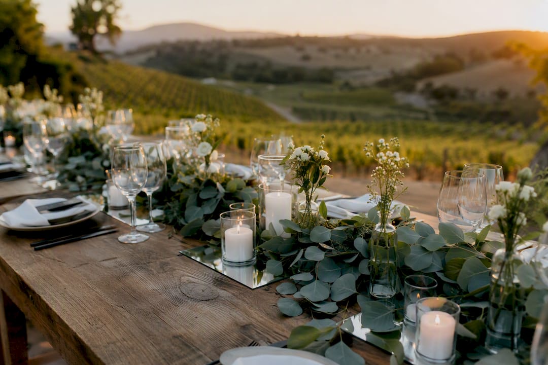 Wedding table with eucalyptus runner and candles
