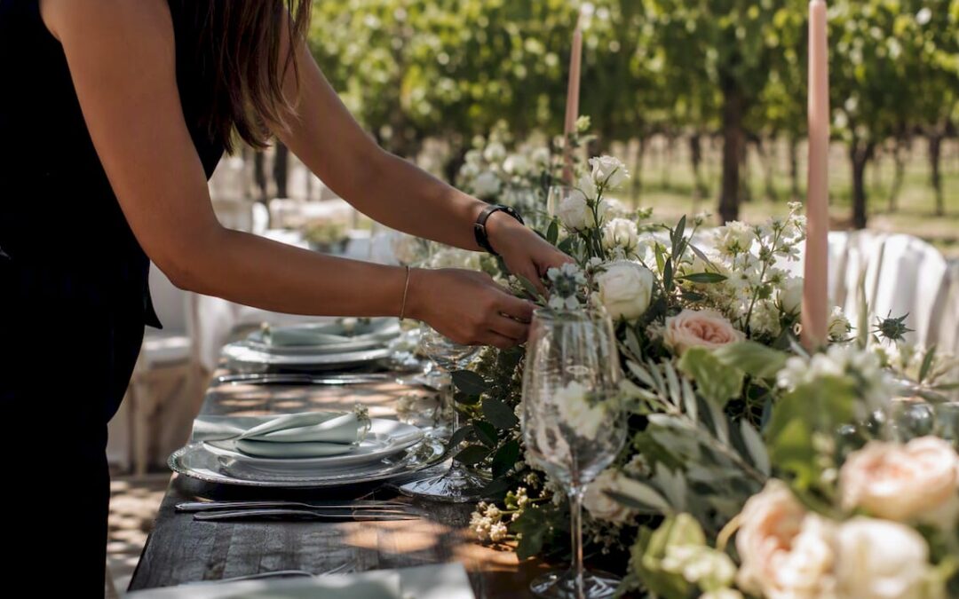 Hands arranging luxury event flowers
