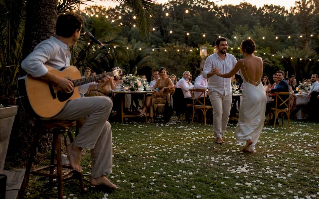 Beach wedding dance floor with steel drum player