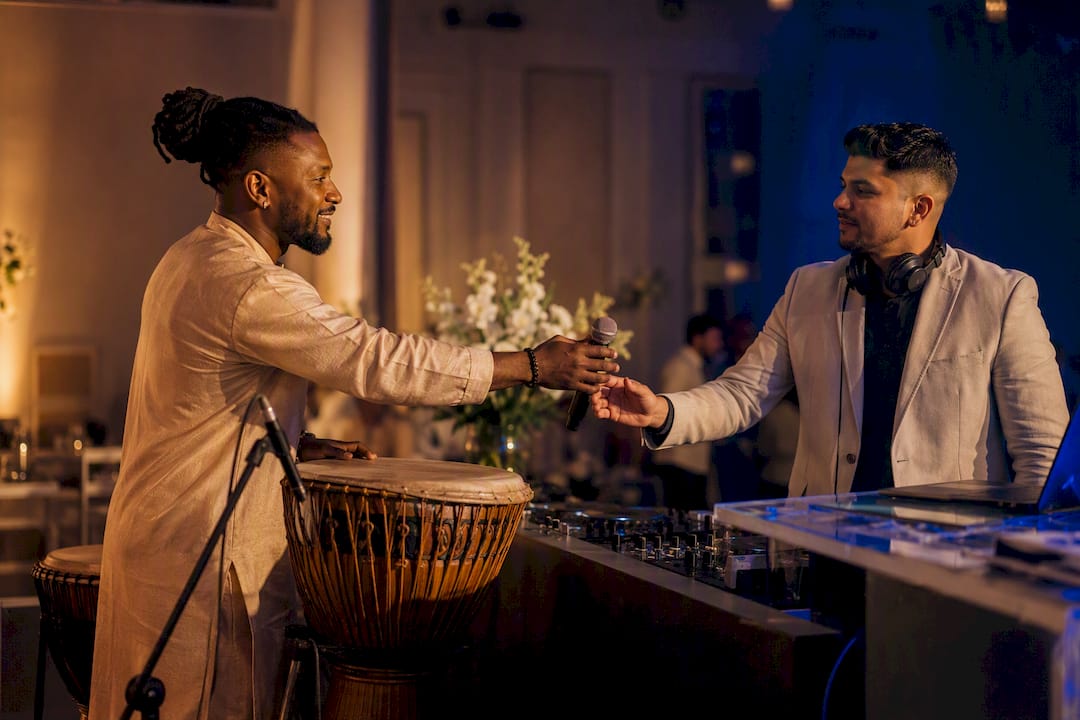 Percussionist and DJ sharing wedding stage