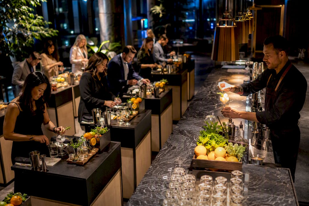 Guests joining a corporate cocktail workshop
